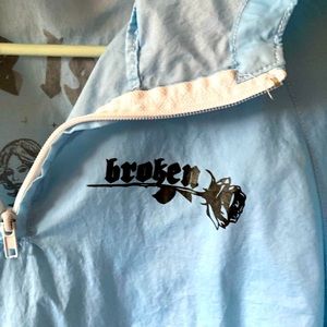 Broken promises baby blue cropped windbreaker